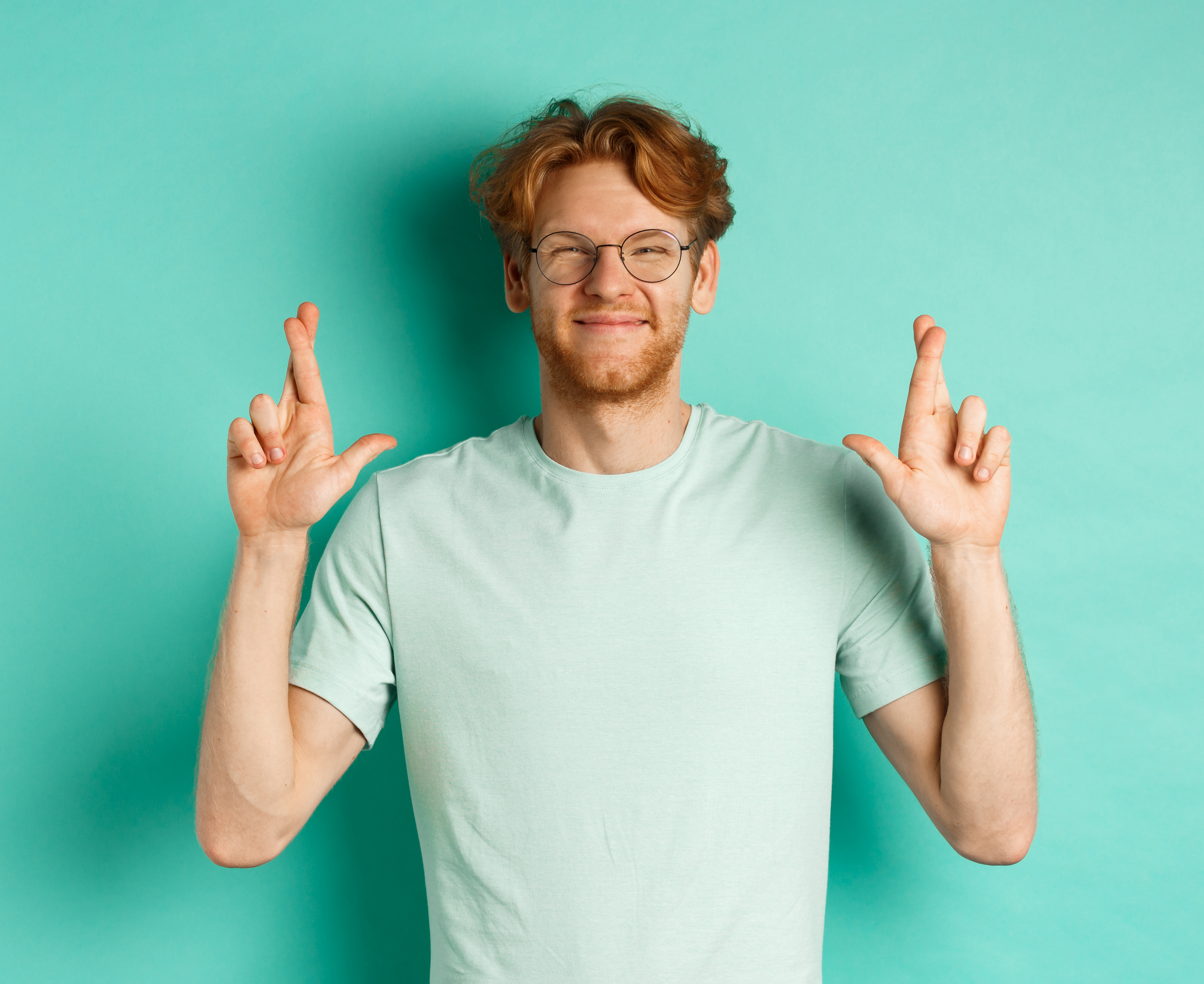 Hero image showing a man on a teal background happy about his prediction.